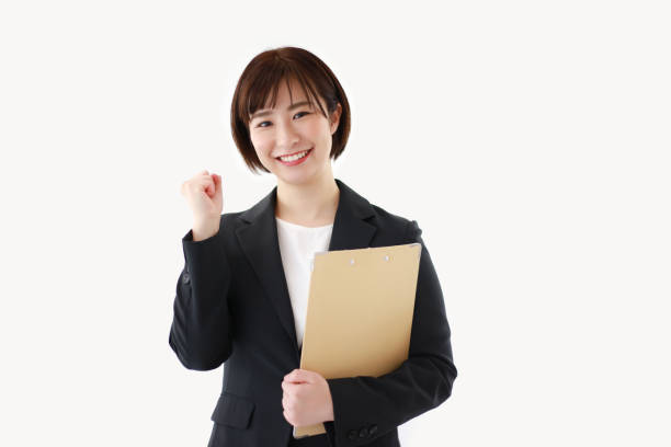 istock Female employee with a binder 1299594360
