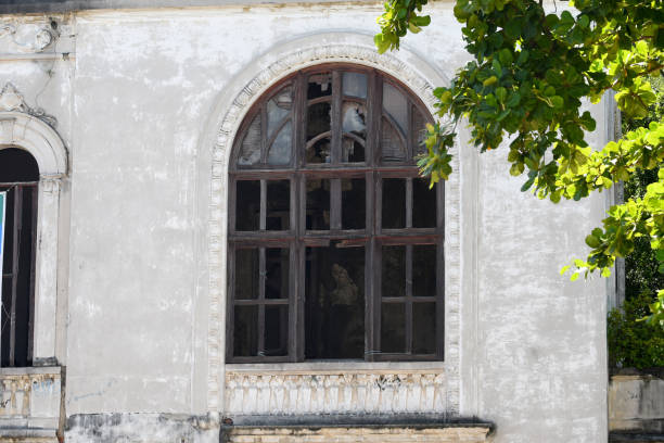 istock destroyed wooden window of abandoned property 1299595215
