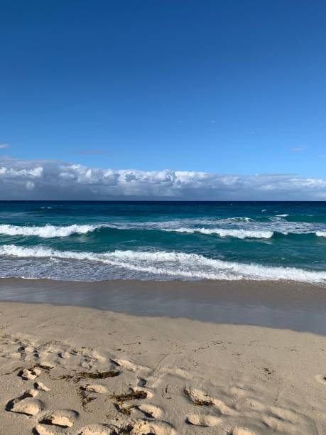 istock Layers of sky, water, and sand 1299595605