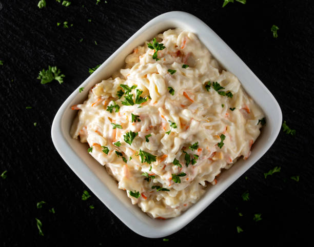 Salad of surimi with mayonnaise sauce and herbs stock photo