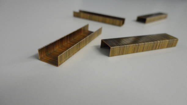 istock Metal staples for stapler isolated on the white office table. 1299598653