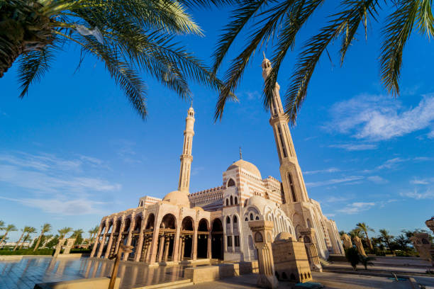 istock Beautiful large Islamic mosque at the sky background 1299600426