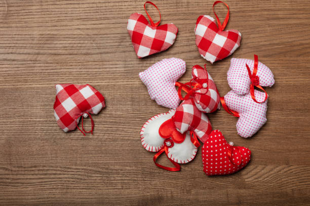 istock Handmaded hearts on wooden background. Valentine's day card 1299601865
