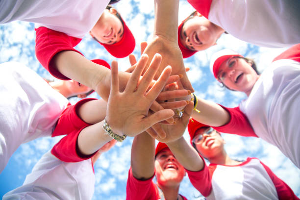 istock Femenil baseball team, celebrating 1299604483