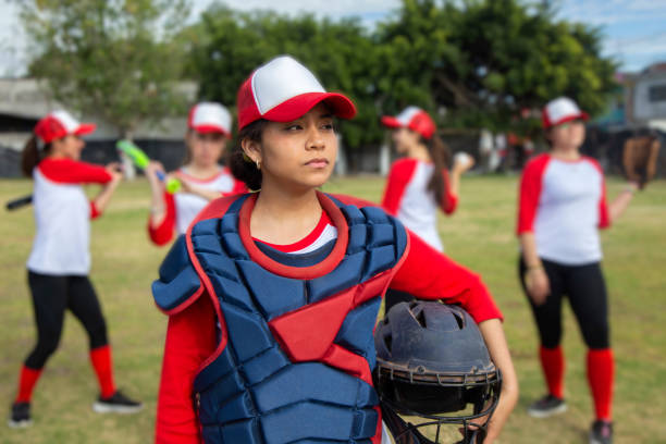 istock Teenage woman baseball player 1299604584