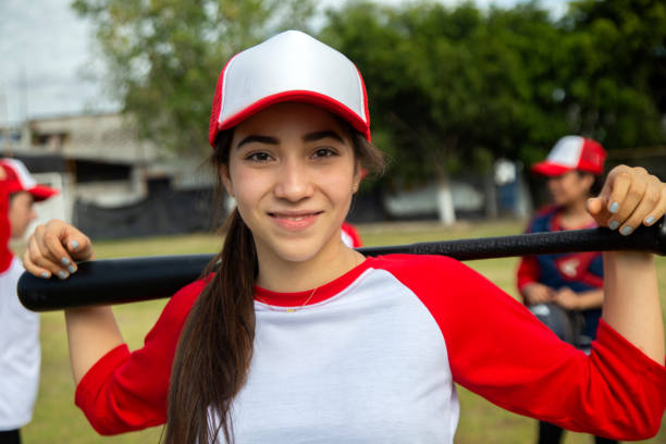 istock Teenage woman baseball player 1299604598