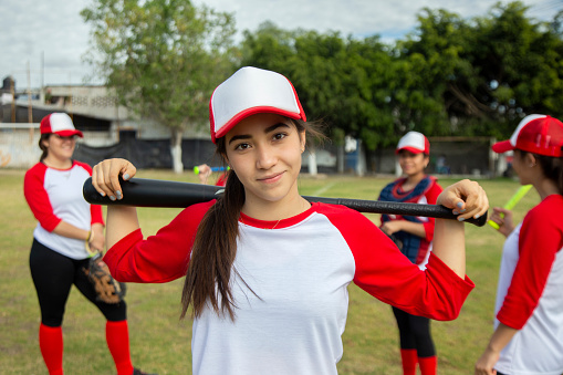 Teenage female baseball player