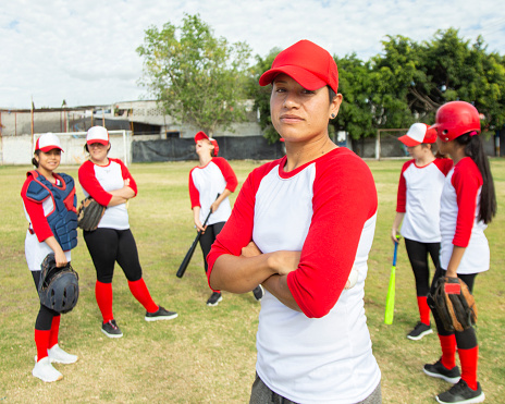 Baseball people and sport team together for huddle at match game on field for motivational support. Professional girl athlete softball group prepare to play outdoor tournament with strategy talk.