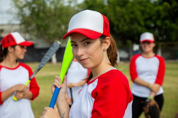 istock Teenage woman baseball player 1299604723