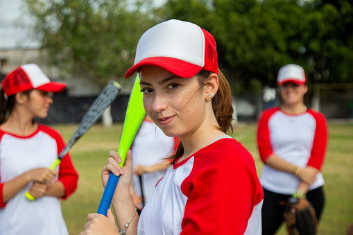 Teenage female baseball player