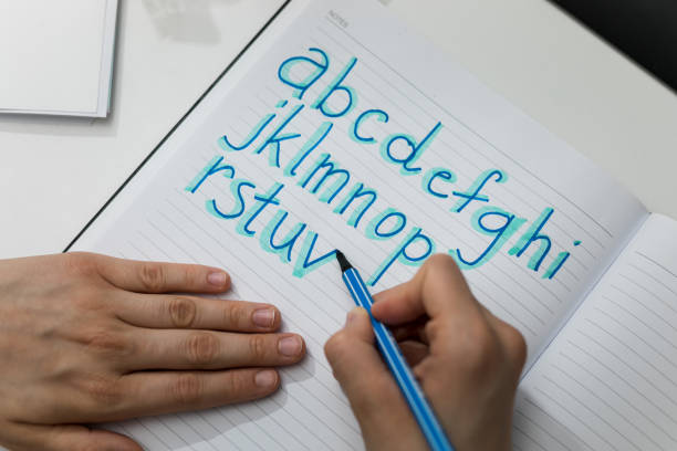 istock Girl drawing the alphabet 1299605548