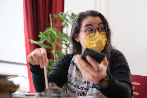 istock Woman with mask working at office in the pandemic 1299606049
