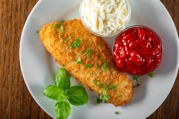 istock Fried fish with ketchup and mayonnaise sauce 1299606689