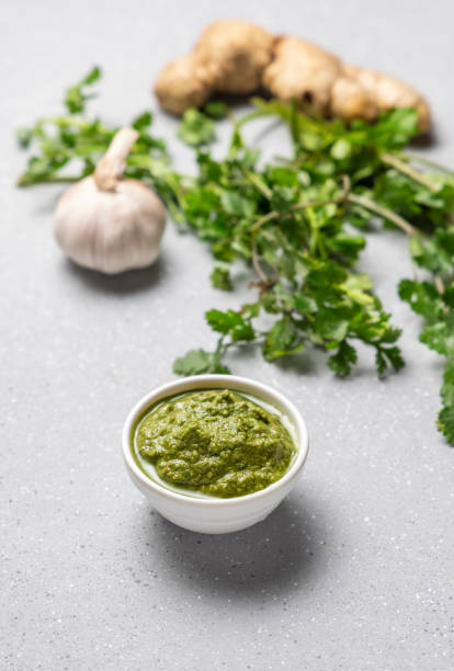 istock green coriander chutney in white bowl 1299607005