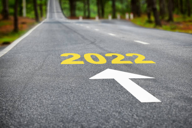 istock New year 2022 on asphalt road surface with white arrow 1299607271