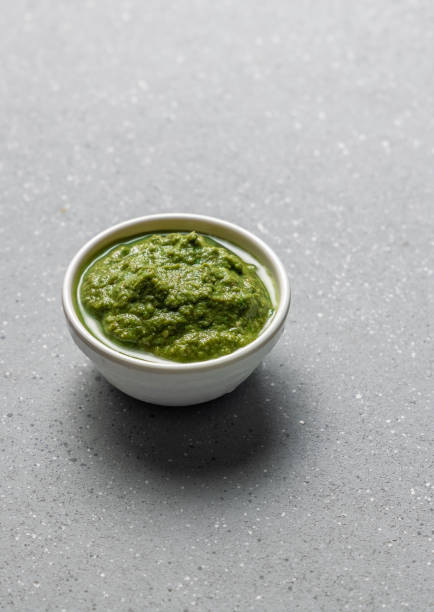 green coriander chutney in white bowl chutney made with coriander leaves and chutney stock pictures, royalty-free photos & images