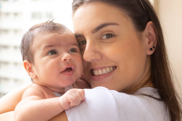 istock Mother with her baby on the lap 1299608240