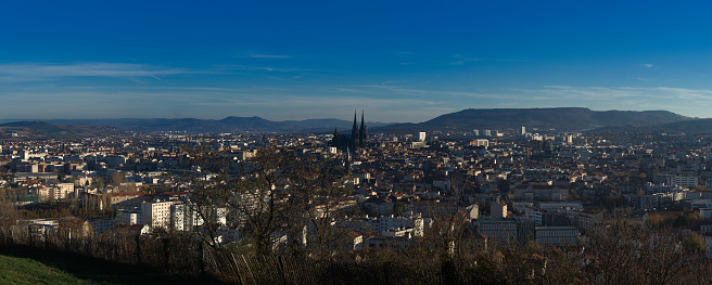 panoramic shot of the city of Clermont-Ferrand and the Notre Dame de l'Assomption Cathedral, in black volcanic stone. Auvergne, Puy-de-Dome, France