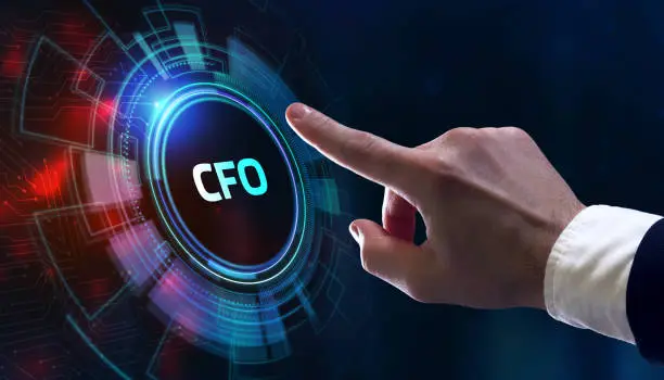 Photo of Business, Technology, Internet and network concept. Young businessman working on a virtual screen of the future and sees the inscription: CFO