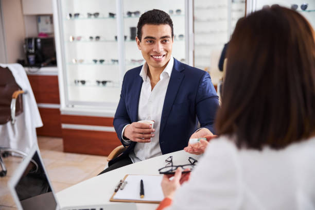 istock Pleased client being consulted by an experienced optician 1299613121