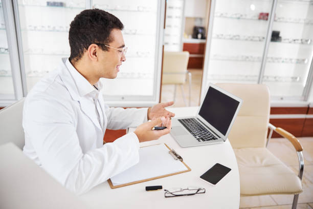 istock Joyous ophthalmologist getting ready to write an eye prescription 1299614842