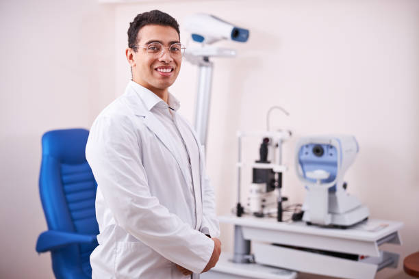 istock High-spirited dark-haired eye doctor posing for the camera 1299614866