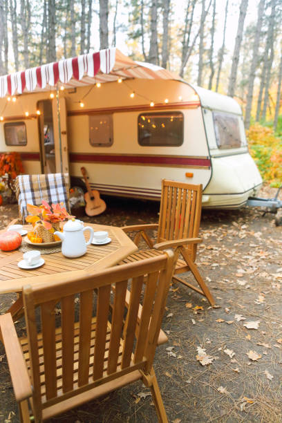 istock Table and chairs outside trailer in nature 1299617342