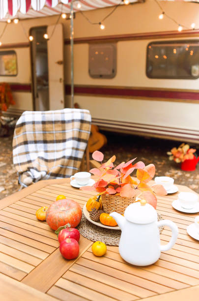 istock Table and chairs outside trailer in nature 1299617370