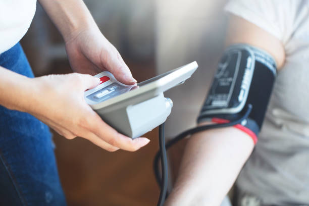 istock Measuring blood pressure 1299617551