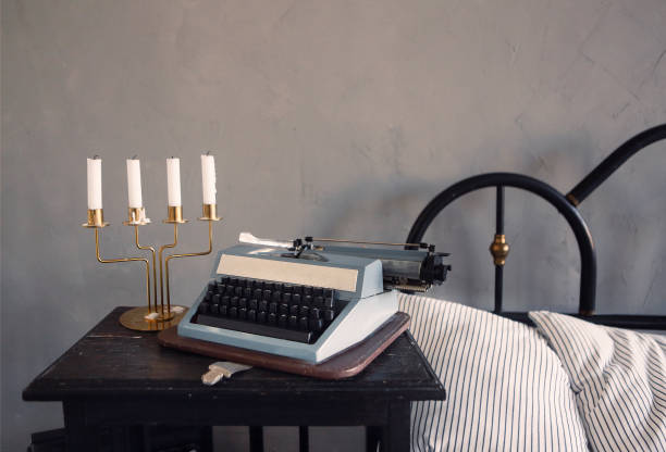 istock Retro candle holder and typewriter in bedroom 1299618148