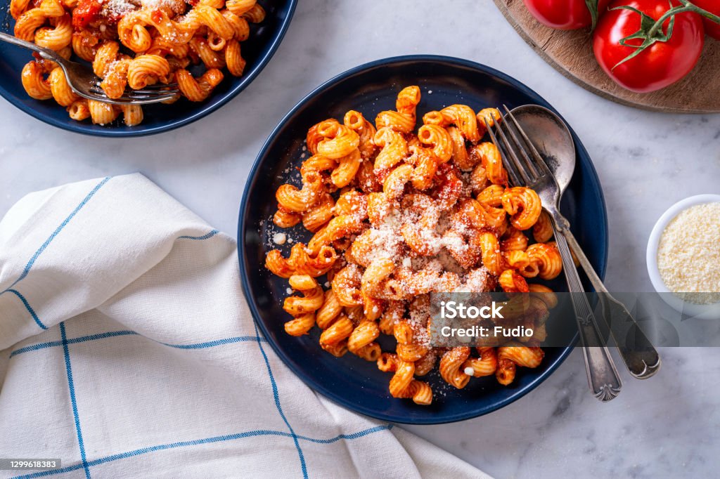 Cavatappi Pasta with Tomato Sauce Delicious cavatappi pasta with tomato sauce and parmesan cheese. Cavatappi Stock Photo
