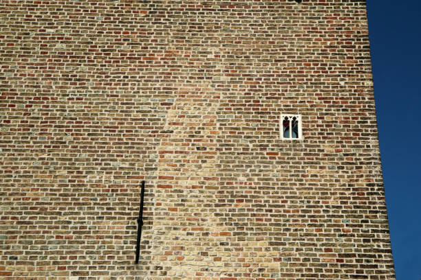 The smallest window on a house in town. Pictured in Bruges in Belgium. Unusual sight hidden from the tourists.