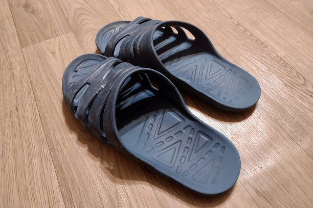 istock old blue rubber flip flops on the floor in the room 1299622157