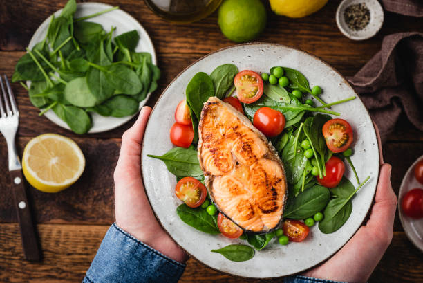 istock Healthy dinner meal with roasted salmon steak 1299622748