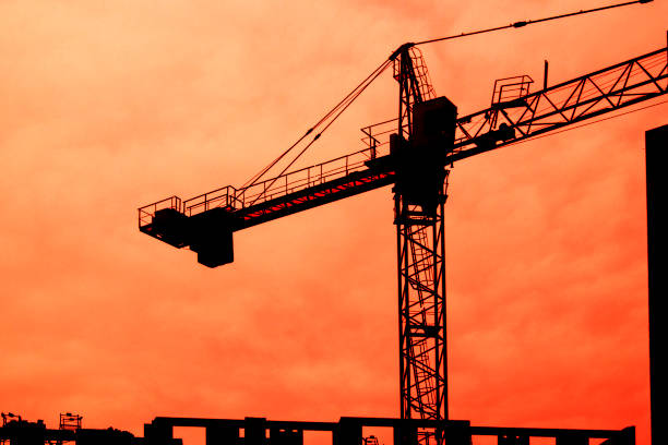 istock arrow of a construction crane against the sky 1299623522