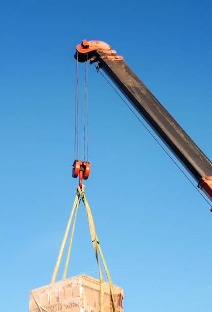 arrow of a construction crane against the sky