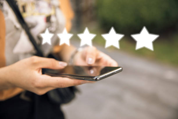 istock woman hand phone and stars 1299626779