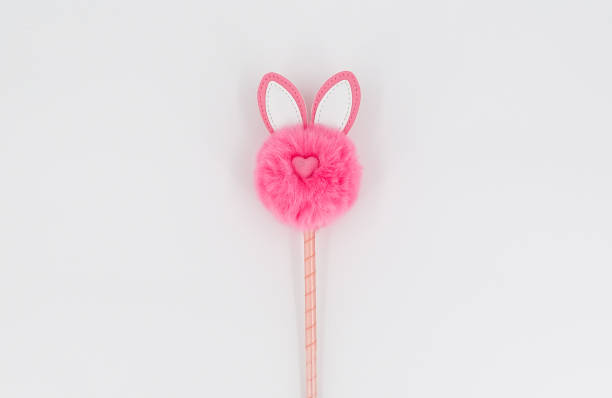 istock Pink fluffy toy on a stick 1299628170