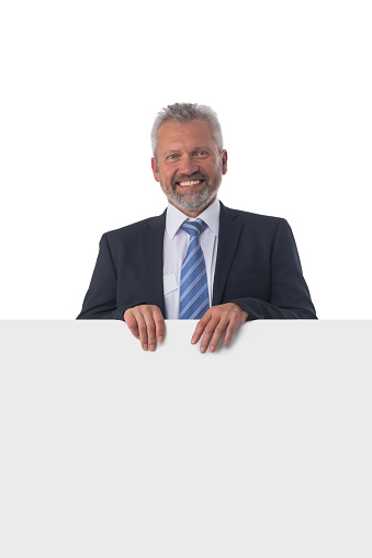Senior business man in suit showing banner whiteboard sign isolated on white background