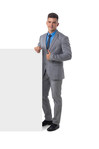 istock Business man in suit with banner 1299630943