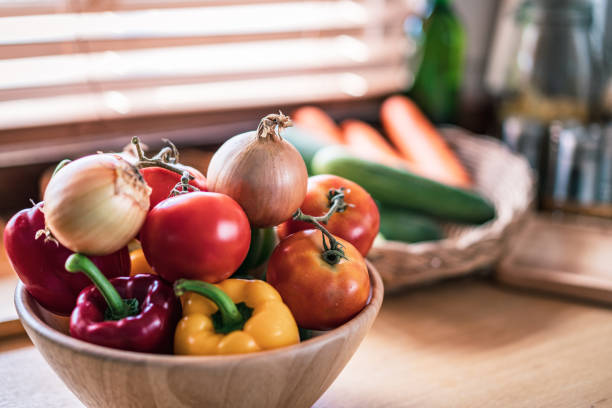 istock Kitchen with organic vegetable in the home and sunlight 1299632354