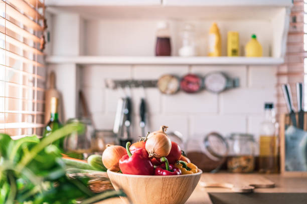 istock Kitchen with organic vegetable in the home and sunlight 1299632357