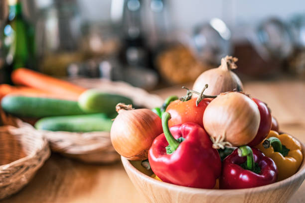 istock Kitchen with organic vegetable in the home and sunlight 1299632358