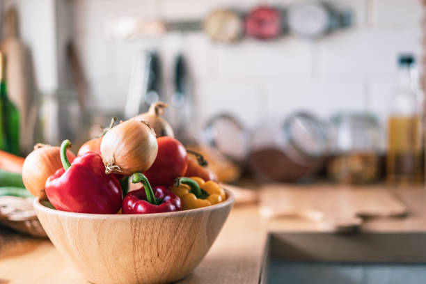 istock Kitchen with organic vegetable in the home and sunlight 1299632367