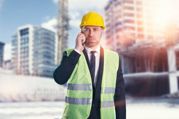 istock A civil engineer talking on the phone with safety helmet in construction site 1299632399