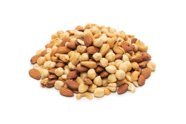 istock Mix of nuts isolated on white background. Top view. 1299633470