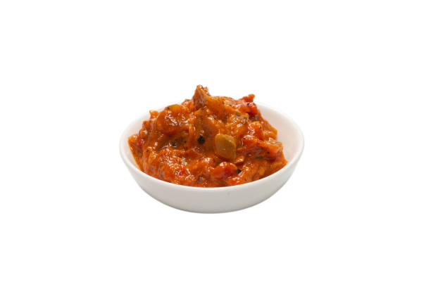 istock Vegetable stew in a bowl isolated on white background. 1299633488