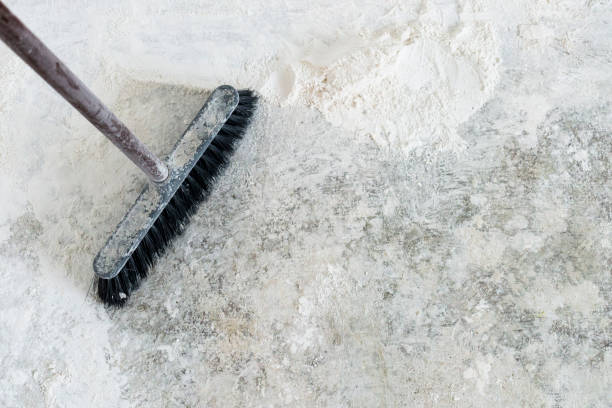 istock Old shabby broom in a corner 1299634404