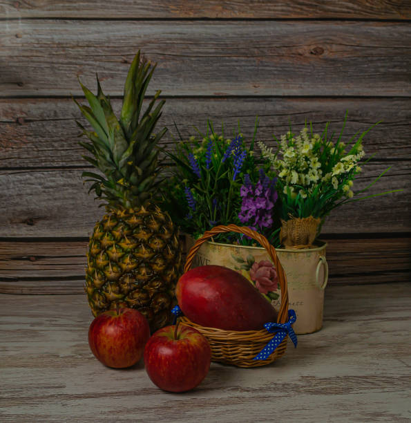 Shot of an unrecognizable woman holding a pineapple stuffed with flowers