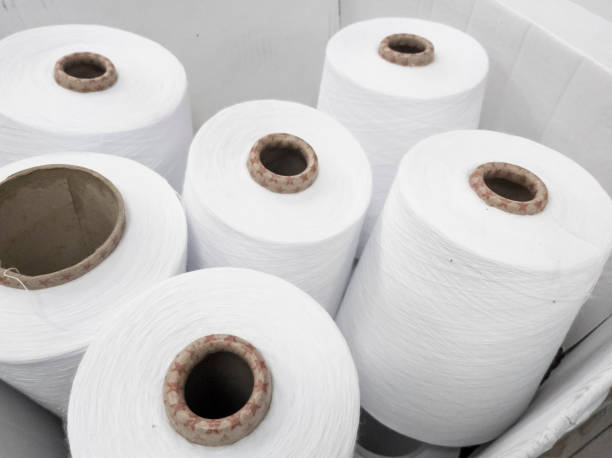 istock white cotton yarn for knitting on knitting machines 1299636294